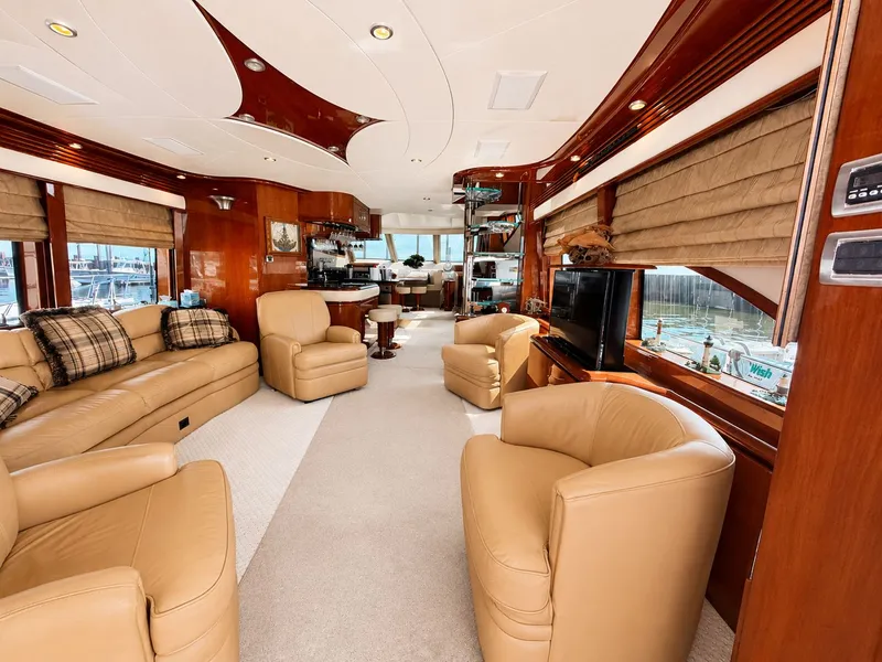 Slide: The Image of Luxurious salon of a 2006 Marquis 65 yacht with leather chairs and large windows. - 3