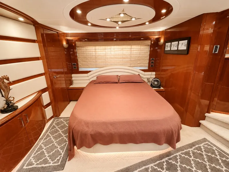 Slide: The Image of Luxurious bedroom with wood-paneled walls, a large bed, and stylish lighting. - 31