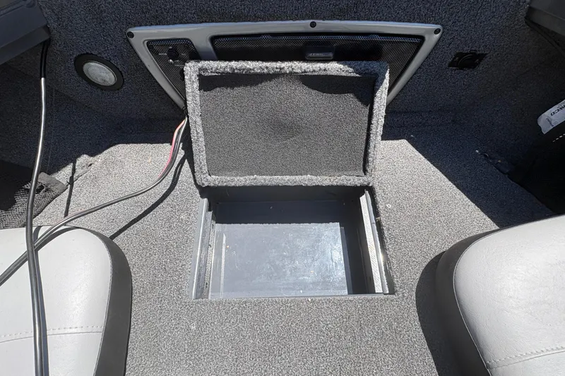 Slide: The Image of Open storage compartment in 2018 Tracker Targa V-18 Combo boat interior. - 18