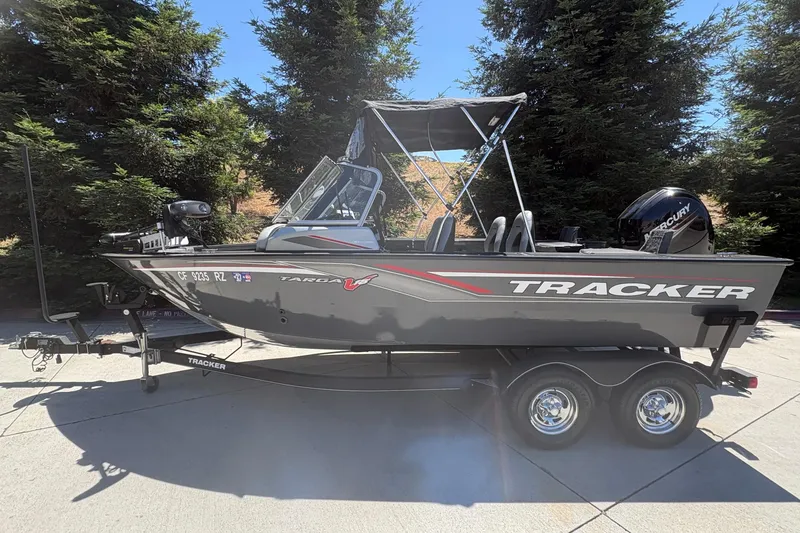The Image of 2018 Tracker Targa V-18 Combo boat on trailer, parked outdoors. - 0