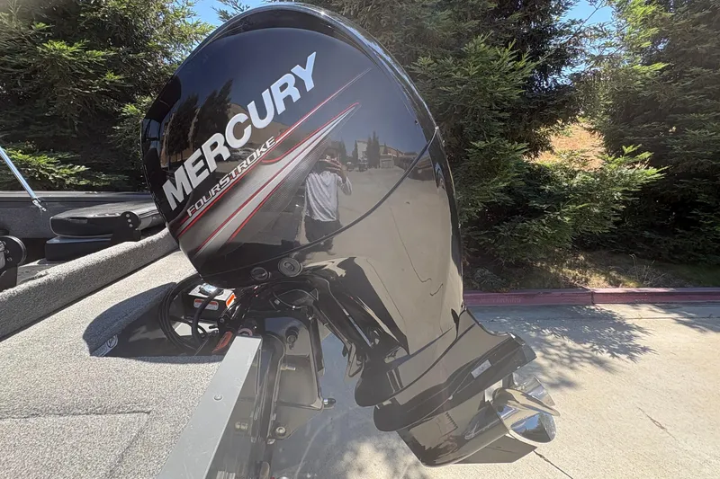 Slide: The Image of Mercury FourStroke engine on 2018 Tracker Targa V-18 Combo boat, outdoors. - 25