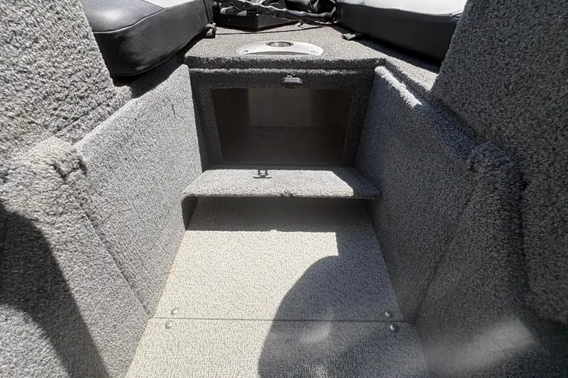 Slide: The Image of Interior storage compartment of 2018 Tracker Targa V-18 Combo boat. - 17