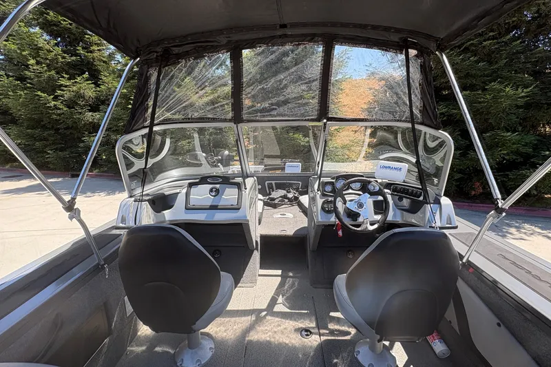 Slide: The Image of 2018 Tracker Targa V-18 Combo boat interior with dual seats and steering console. - 22