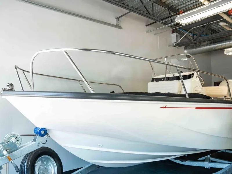 The Image of A 2026 Boston Whaler 190 Montauk is indoors on a trailer. - 1