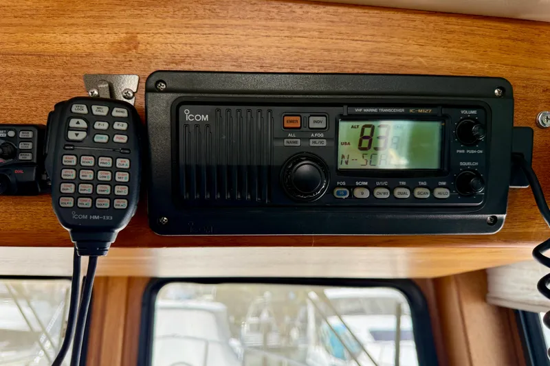 Slide: The Image of VHF marine transceiver and microphone on a 2000 Nordic Tug 37 boat. - 63