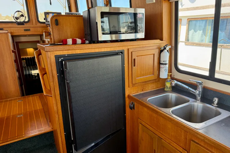 Slide: The Image of Sink, microwave, and fridge. - 17