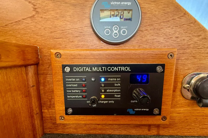 Slide: The Image of Digital multi-control panel on a 2000 Nordic Tug 37 boat, featuring Victron Energy display. - 71