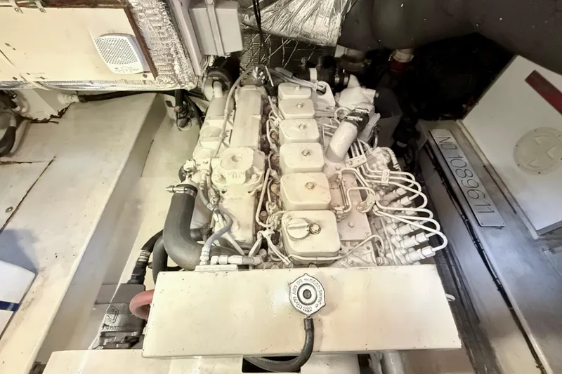 Slide: The Image of Engine room of a 2000 Nordic Tug 37, showcasing detailed mechanical components. - 83