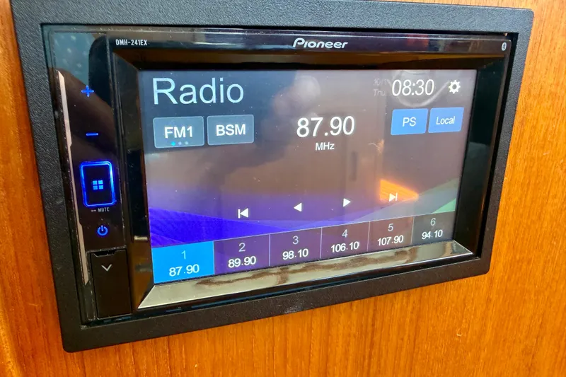 Slide: The Image of Pioneer radio display in a 2000 Nordic Tug 37, tuned to 87.90 MHz FM. - 69