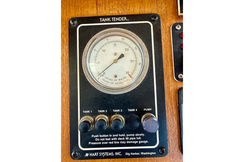 Slide: The Image of Tank tender gauge on 2000 Nordic Tug 37, displaying water and diesel levels. - 65