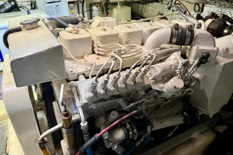 Slide: The Image of Engine compartment of a 2000 Nordic Tug 37, showcasing detailed mechanical components. - 84