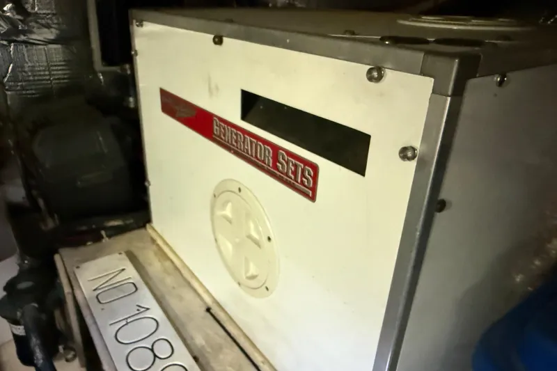 Slide: The Image of Generator set inside a 2000 Nordic Tug 37 boat engine room. - 86