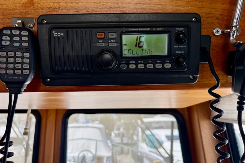 Slide: The Image of VHF marine radio on 2000 Nordic Tug 37, channel 16 calling. - 64