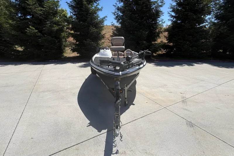 Slide: The Image of 2008 Nitro Z-7 boat parked on concrete with trees in the background. - 8