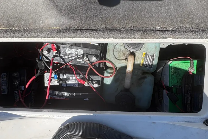Slide: The Image of Battery compartment of a 2008 Nitro Z-7 boat with wiring and fuel tank. - 24