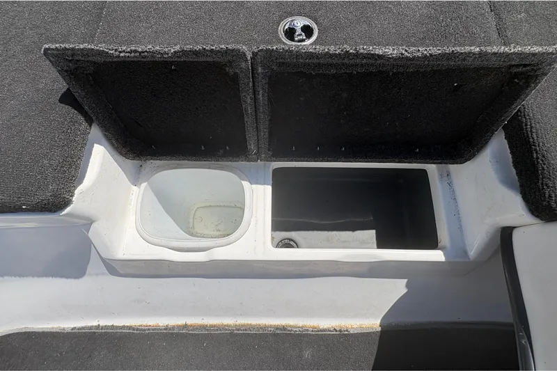 Slide: The Image of 2008 Nitro Z-7 boat storage compartments with open lids, showcasing interior space. - 23