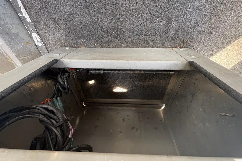 Slide: The Image of Interior view of a 1997 Duroboat 14rlw storage compartment with wiring. - 15