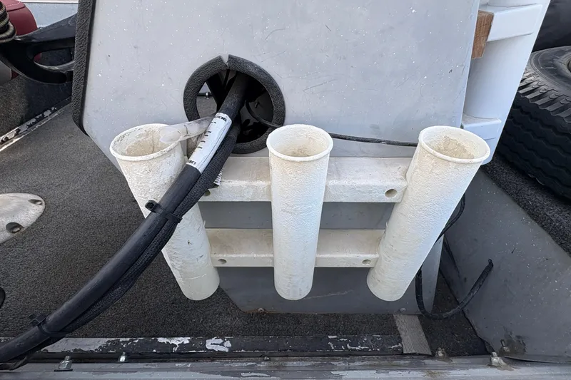 Slide: The Image of 1997 Duroboat 14rlw interior with rod holders and cables. - 13