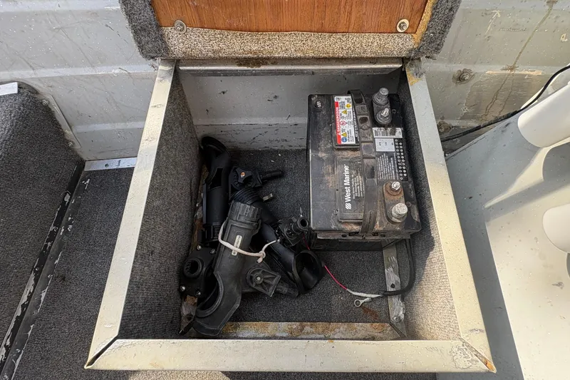 Slide: The Image of Battery compartment of a 1997 Duroboat 14rlw with marine equipment. - 9