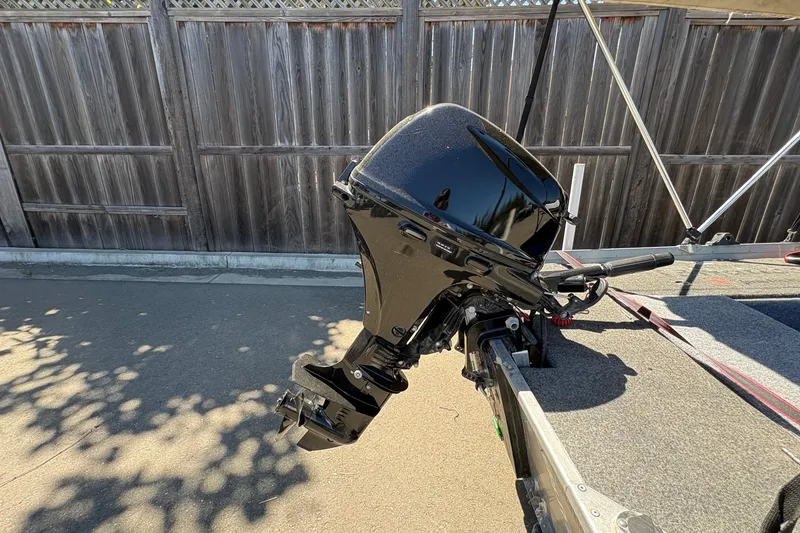 Slide: The Image of Black outboard motor on a boat trailer, Grumman 1065, 1994 model. - 10