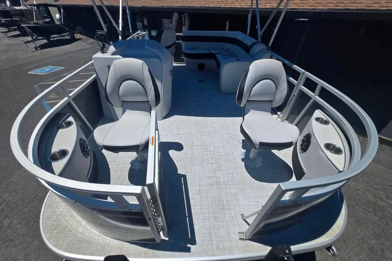 Slide: The Image of 2025 BERSHIRE SE 16 pontoon boat interior with seating and cup holders. - 4