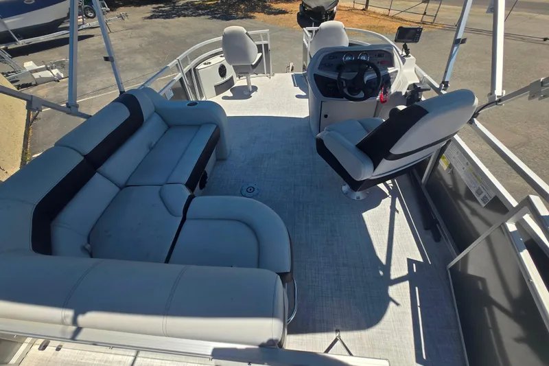 Slide: The Image of Interior of 2025 BERSHIRE SE 16 pontoon boat with seating and steering console. - 9