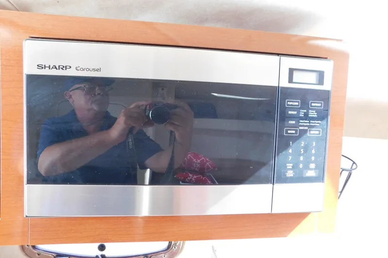 Slide: The Image of Sharp Carousel microwave inside a 2010 Sea Ray Sundancer 260 boat kitchen. - 58