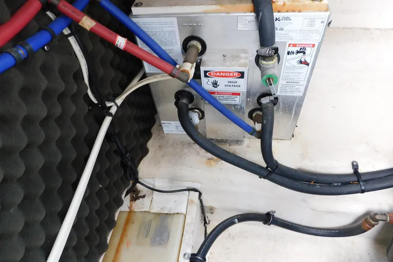 Slide: The Image of Engine compartment of a 2010 Sea Ray Sundancer 260 with high voltage warning. - 14