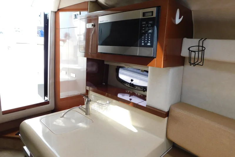 Slide: The Image of Interior of 2010 Sea Ray Sundancer 260 yacht with kitchenette and microwave. - 55