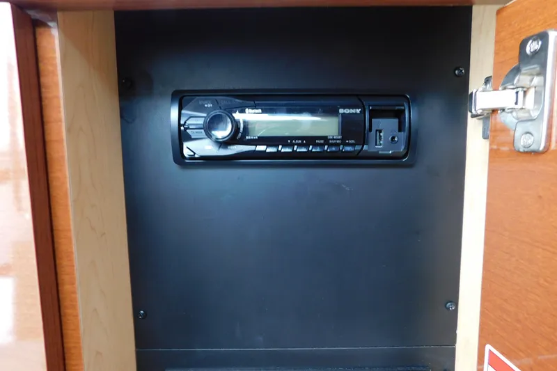 Slide: The Image of Sony stereo system inside 2010 Sea Ray Sundancer 260 boat cabinet. - 65