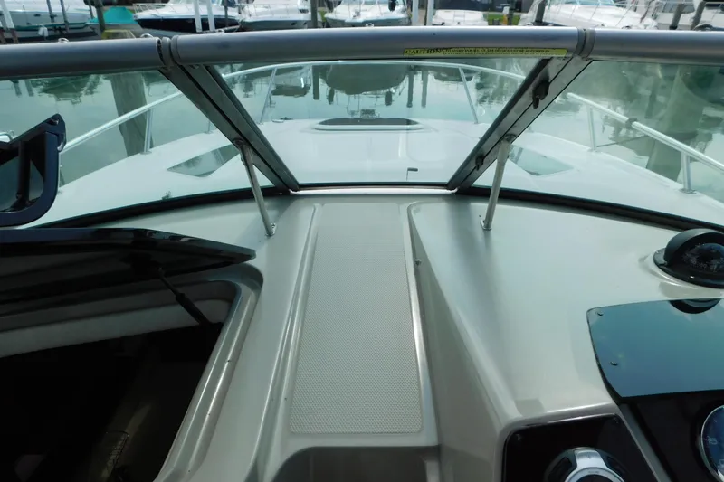 Slide: The Image of 2010 Sea Ray Sundancer 260 boat dashboard with windshield and compass. - 27