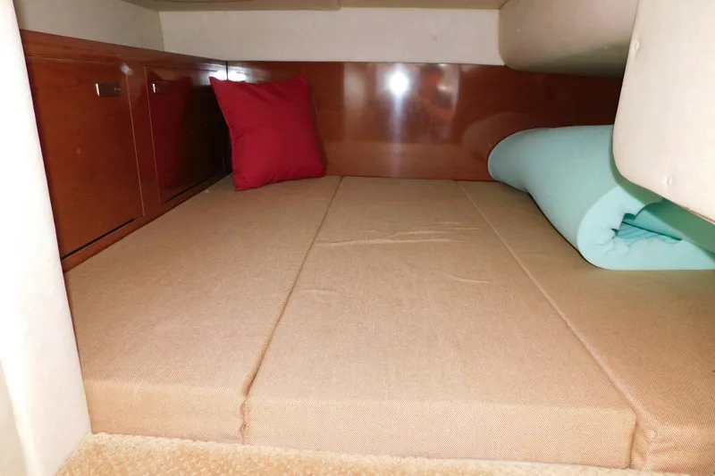 Slide: The Image of Interior cabin of 2010 Sea Ray Sundancer 260 with cushions and storage. - 43