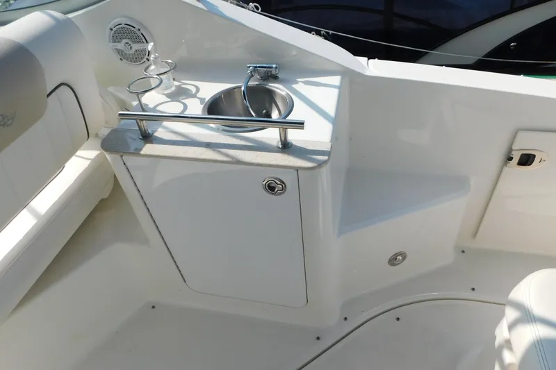 Slide: The Image of Interior of 2010 Sea Ray Sundancer 260 boat with sink and seating area. - 17