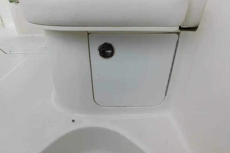 Slide: The Image of 2010 Sea Ray Sundancer 260 boat interior storage compartment with white finish. - 75