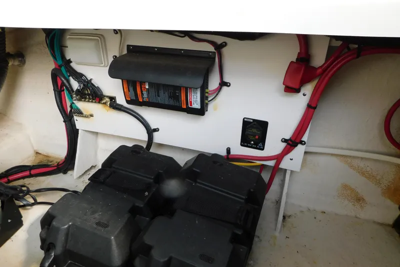 Slide: The Image of Electrical system of a 2010 Sea Ray Sundancer 260 boat, featuring wiring and battery components. - 13