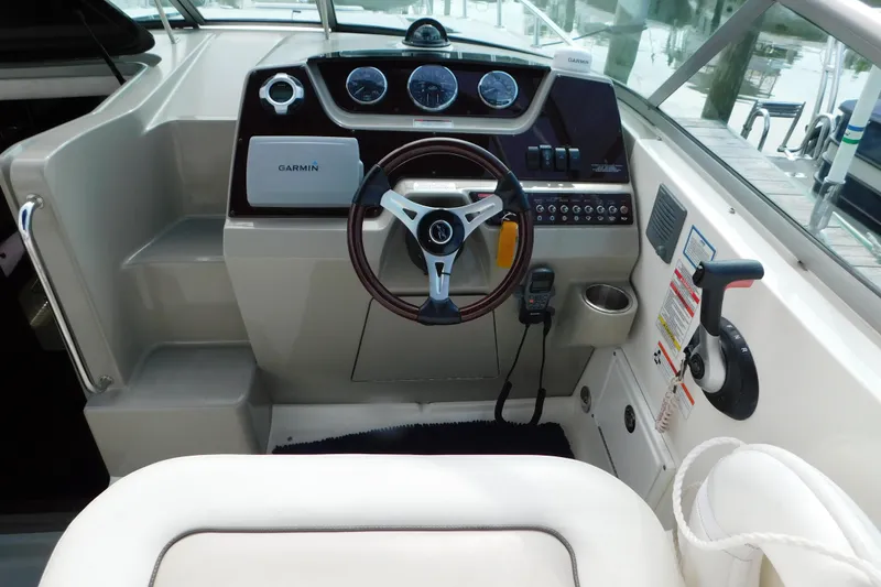 Slide: The Image of Cockpit of 2010 Sea Ray Sundancer 260 with Garmin navigation system and steering wheel. - 20