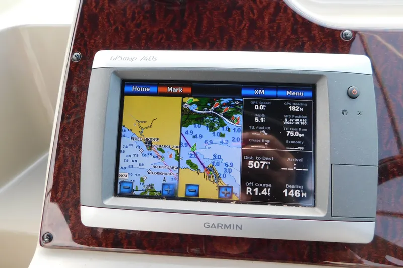 Slide: The Image of Garmin GPS display on 2010 Sea Ray Sundancer 260, showing navigation and route details. - 21