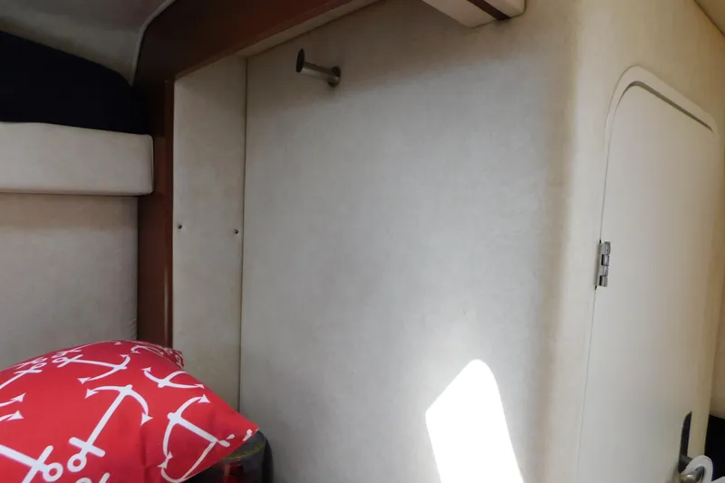 Slide: The Image of Interior of 2010 Sea Ray Sundancer 260 with red anchor-patterned pillow. - 57