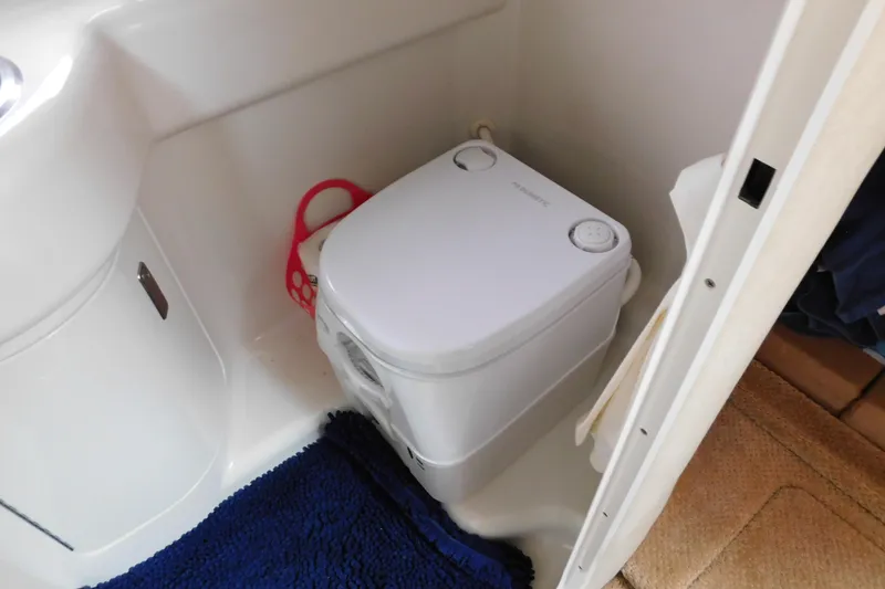 Slide: The Image of Compact marine toilet in 2010 Sea Ray Sundancer 260 boat bathroom. - 72
