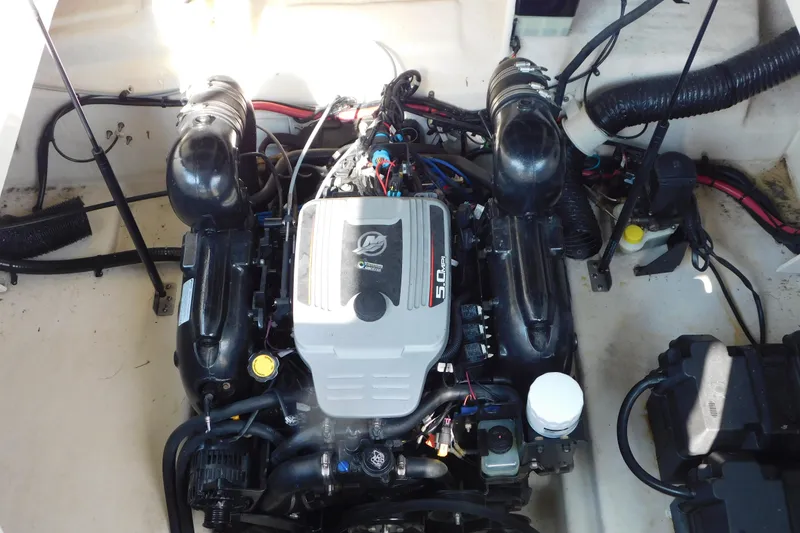 Slide: The Image of Engine compartment of a 2010 Sea Ray Sundancer 260 boat, featuring a 5.0 MPI engine. - 15