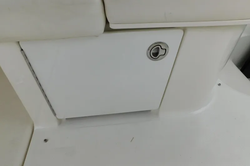 Slide: The Image of 2010 Sea Ray Sundancer 260 storage compartment with lockable door. - 77