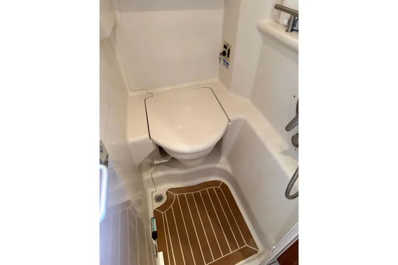 Slide: The Image of Compact bathroom in 2008 Sea Ray Sundancer 350 yacht with toilet and wooden floor. - 23