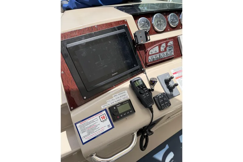 Slide: The Image of Control panel of a 2008 Sea Ray Sundancer 350 boat with navigation equipment. - 33