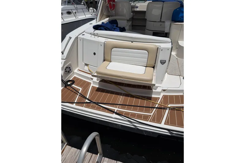 Slide: The Image of 2008 Sea Ray Sundancer 350 boat with tan seating and teak-style deck. - 41