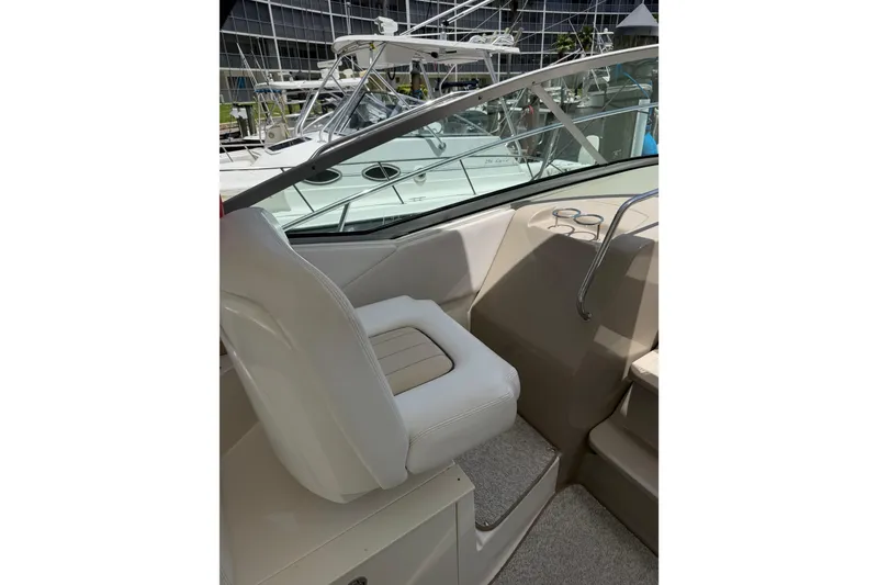 Slide: The Image of 2008 Sea Ray Sundancer 350 interior with white seating and cup holders. - 5