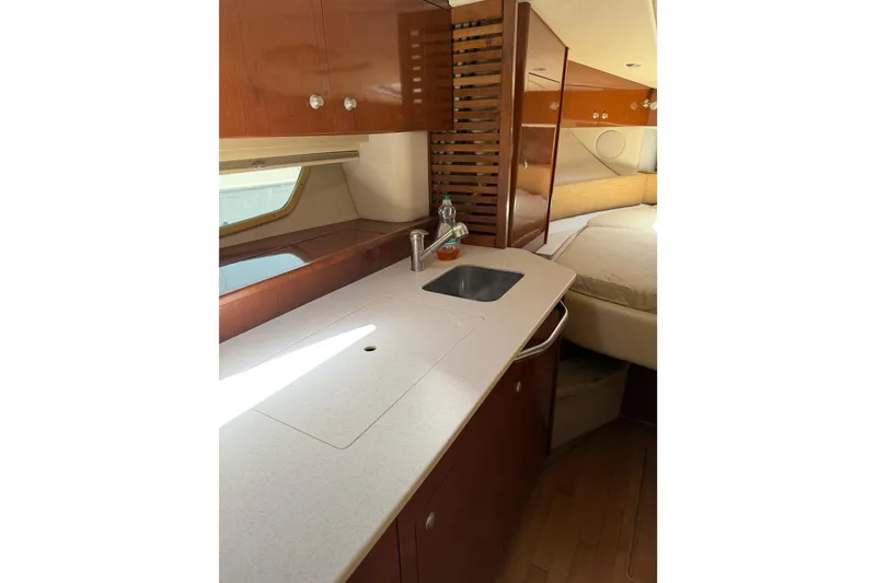 Slide: The Image of 2008 Sea Ray Sundancer 350 yacht interior with kitchenette and bed. - 14