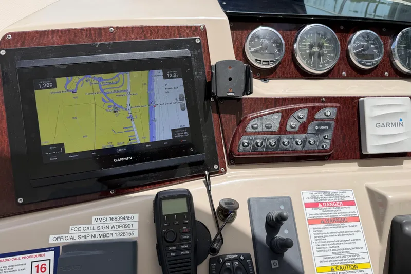 Slide: The Image of Control panel of a 2008 Sea Ray Sundancer 350 with Garmin navigation system. - 34