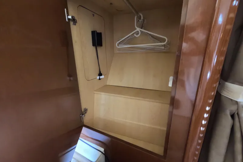 Slide: The Image of Wooden closet interior on a 2008 Sea Ray Sundancer 350 yacht. - 24