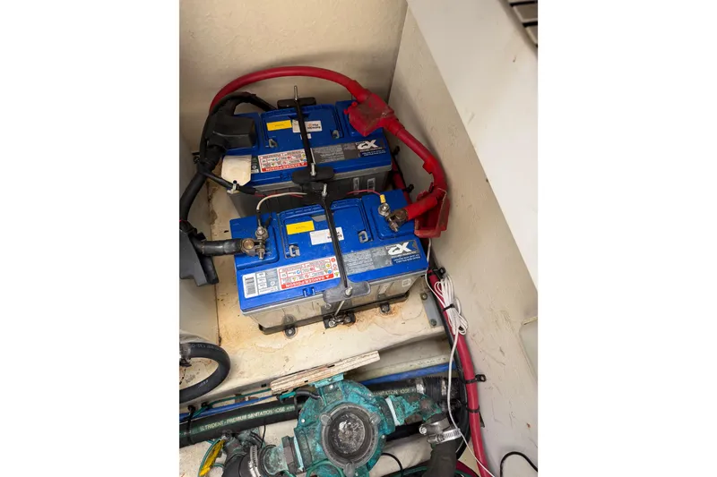 Slide: The Image of 2008 Sea Ray Sundancer 350 boat batteries and wiring in engine compartment. - 30