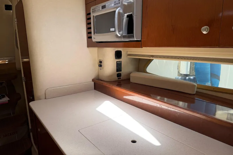 Slide: The Image of Interior of 2008 Sea Ray Sundancer 350 yacht kitchen with microwave and countertop. - 8
